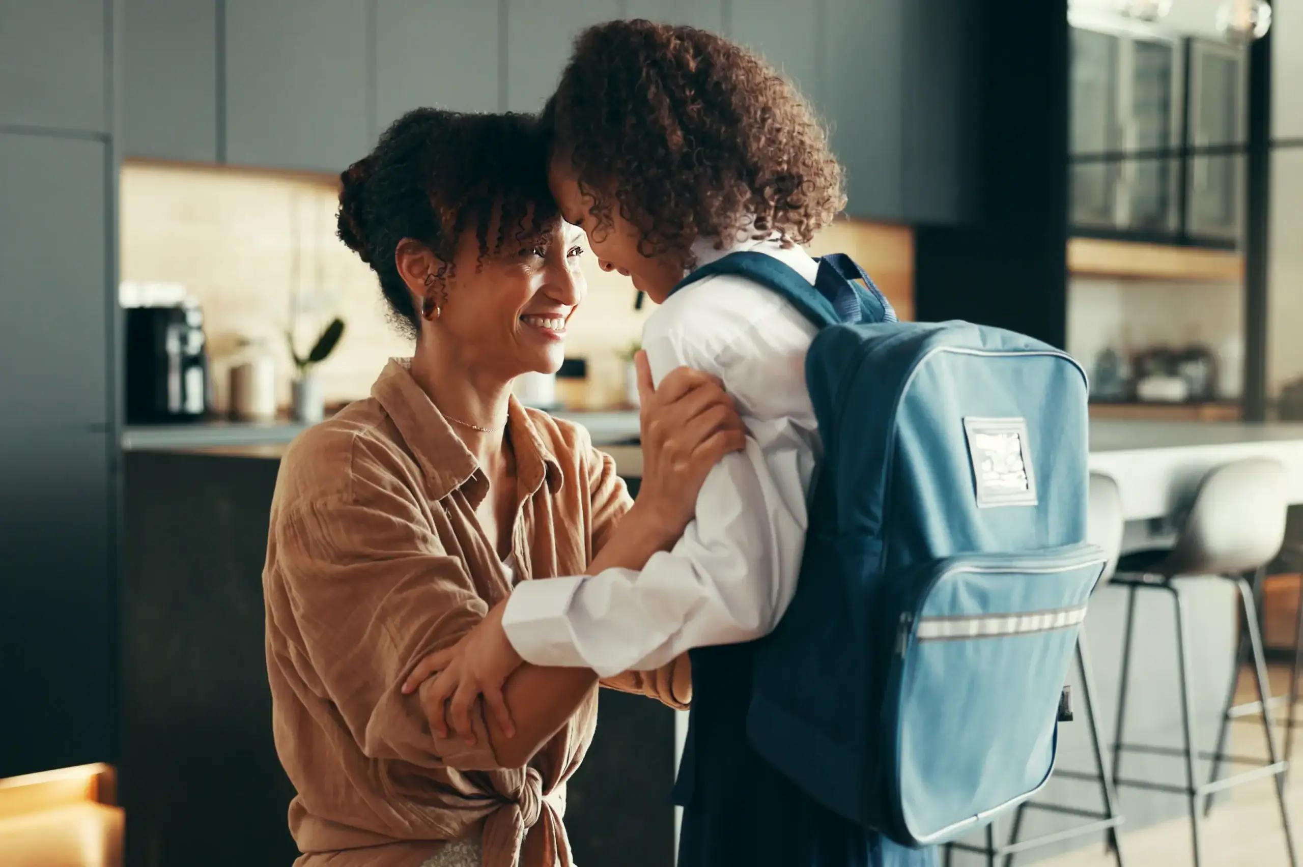 Mom encourages her child as the child heads back to school
