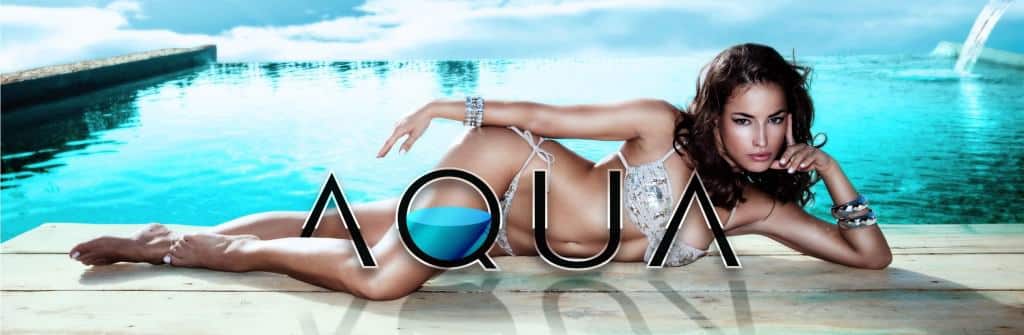 woman in bikini lies on a dock; AQUA Plastic Surgery Jupiter