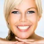 smiling woman with blond hair for nonsurgical treatments at Aqua Plastic Surgery