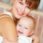 happy mom hugs her child