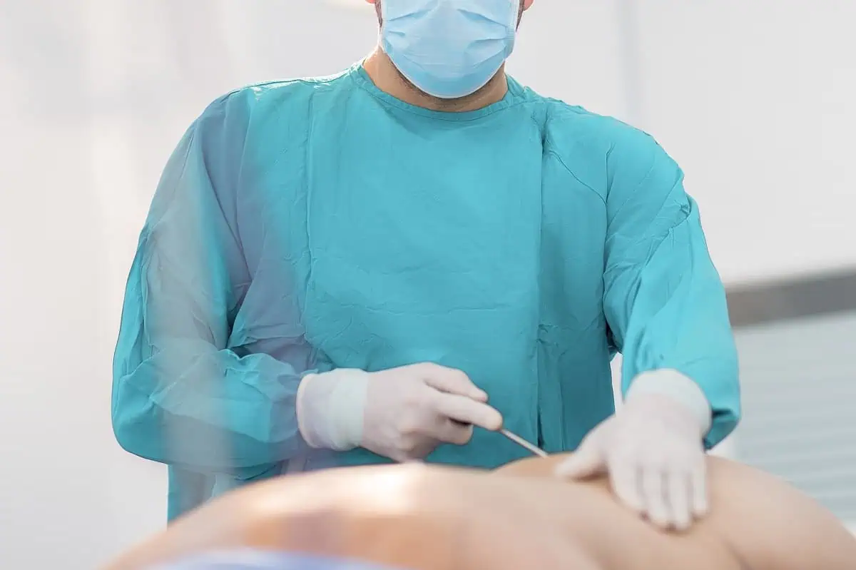 A surgeon operating on a patient
